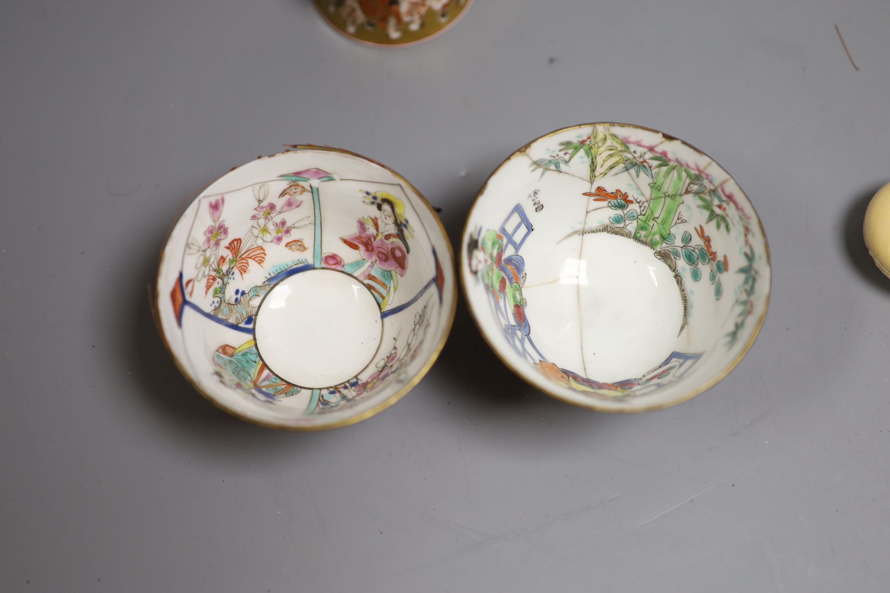 A Japanese ivory manju shaped okimono, three cups & two saucers, all Meiji period.